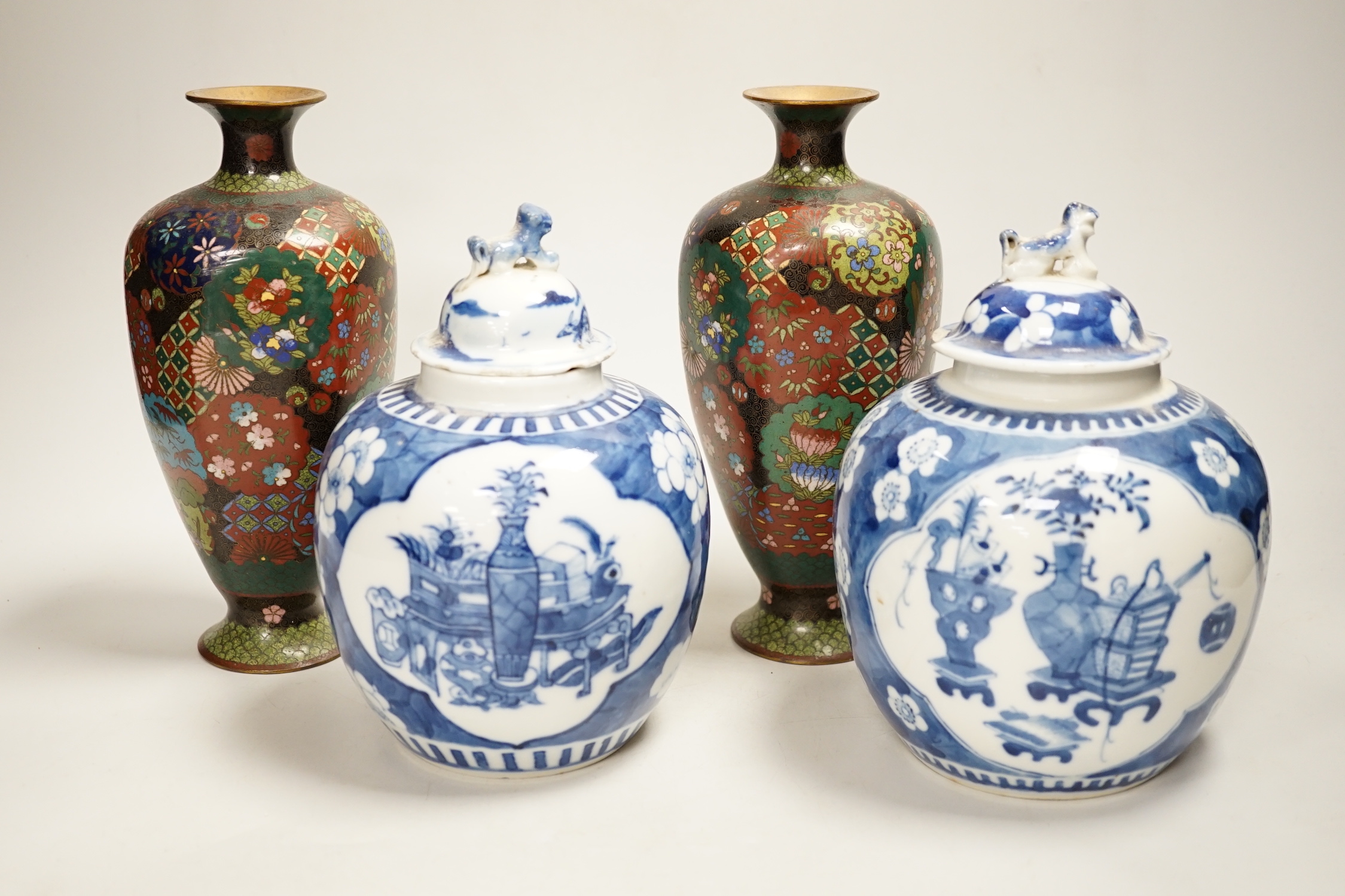 A pair of Chinese blue and white jars and associated covers and a pair of Japanese cloisonné enamel vases, cloisonné vases 21cm high